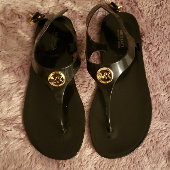 Michael Kors Shoes - Michael Kors black/gold thong buckle sandals.
